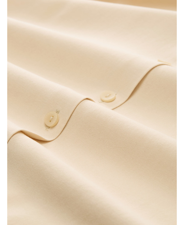 Top met knoopsluiting